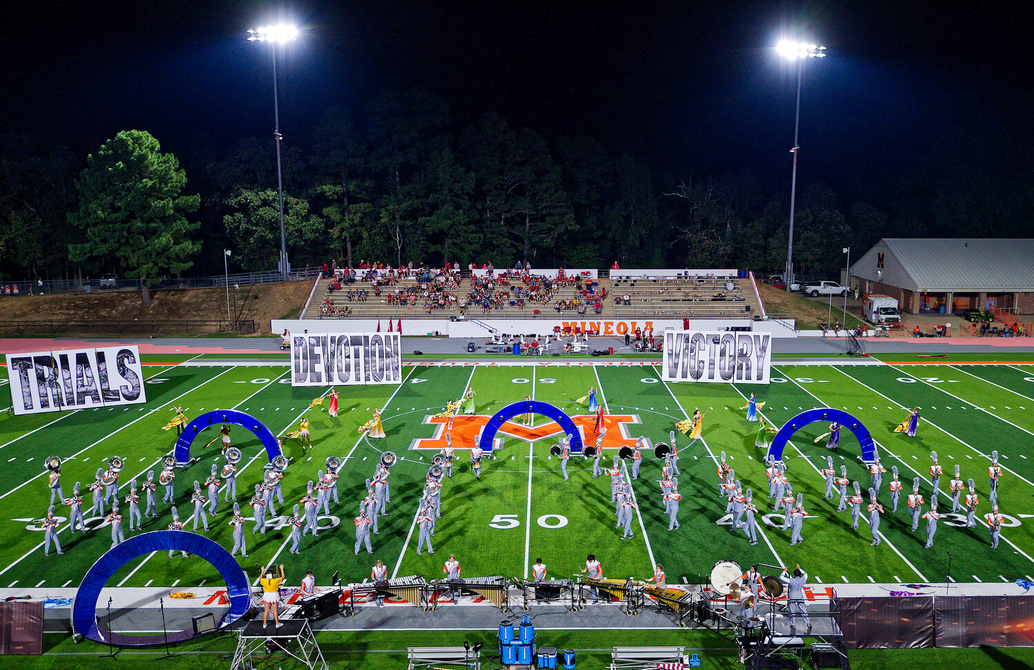 Mineola performs their competition show during halftime of the Pottsboro game Friday on the field at Meredith Memorial Stadium, where bands from around the area will compete Monday.